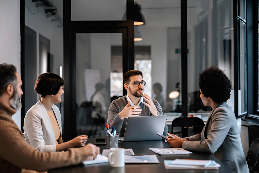 Partners meeting around a conference table